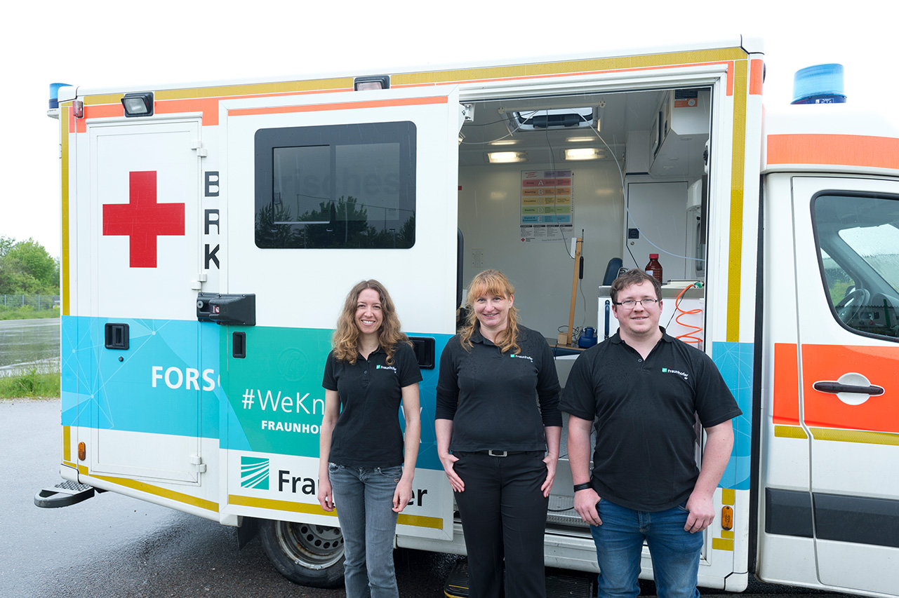 SafeCar research team in front of the research vehicle